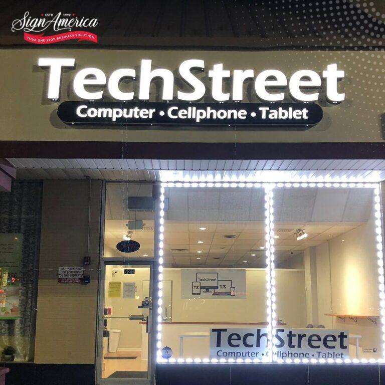Illuminated storefront sign installed by Sign America