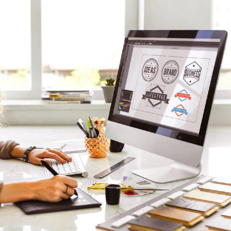 Designer preparing print-ready artwork at Sign America