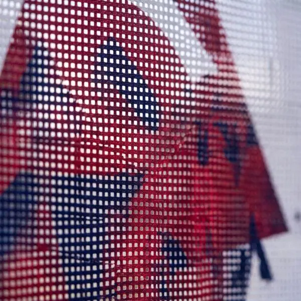 Close-up of perforated mesh banner weave and print — Sign America Chicago