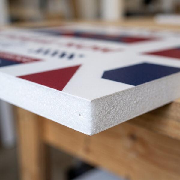 Close-up of 6mm PVC foam board edge and smooth printed surface — Sign America Chicago