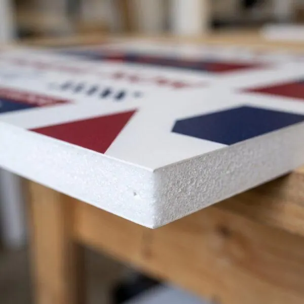 Close-up of 6mm PVC foam board edge and smooth printed surface — Sign America Chicago