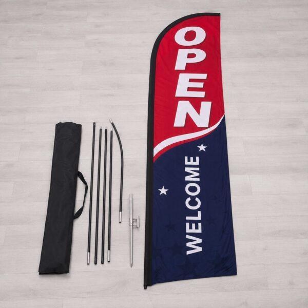Feather flag kit contents laid out with pole kit and spike — Sign America Chicago